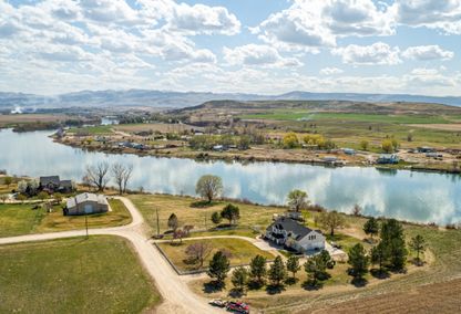 Waterfront home on the Snake River in Idaho with mountain views, listed by Top Idaho Real Estate